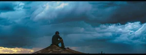 a roofer hurriedly fixing a leaky roof under stormy skies in west windsor, nj.